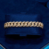 8mm Moissanite Cuban Link bracelet in 18k gold vermeil with D color VVS1 stones on navy velvet background