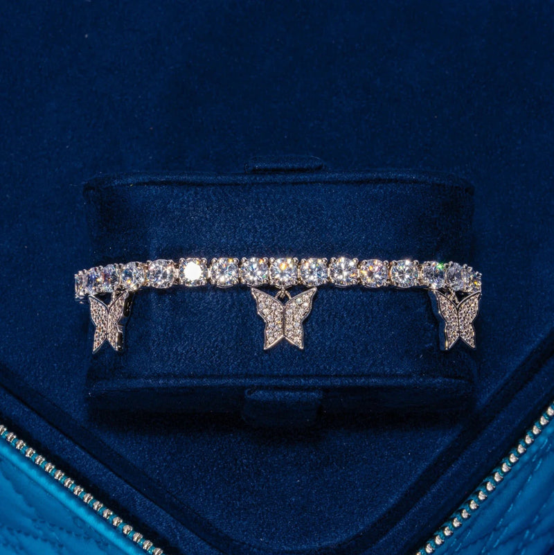 Iced Butterfly Tennis Bracelet in white gold with butterfly motifs and shimmering stones in a blue velvet display box