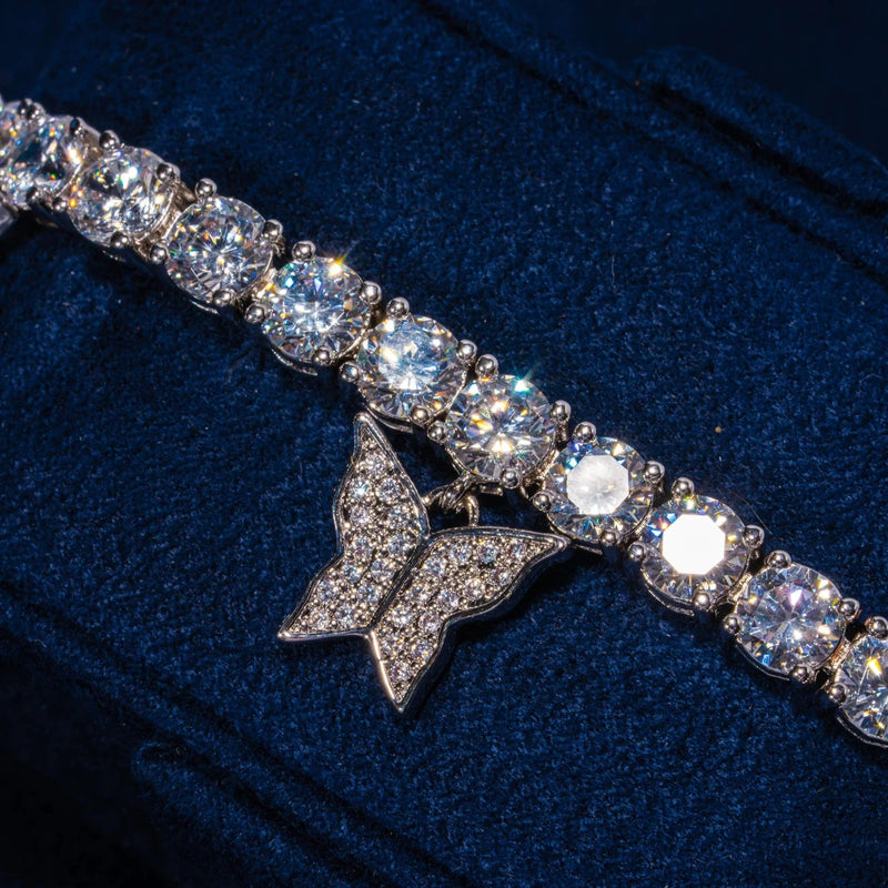 Iced Butterfly Tennis Bracelet in white gold with detailed butterfly and sparkling stones on dark background