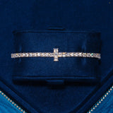 3MM Tennis Cross Bracelet in white gold with cubic zirconia stones in a tennis setting on navy blue velvet background