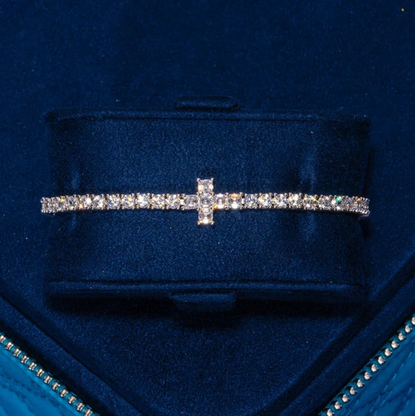 3MM Tennis Cross Bracelet in white gold with cubic zirconia stones in a tennis setting on navy blue velvet background
