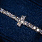 3MM Tennis Cross Bracelet in white gold with sparkling CZ stones on dark blue background