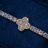 3MM Moissanite iced motif tennis bracelet in 925 silver with white gold plating on dark blue background