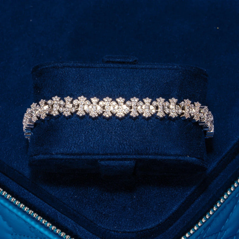 8.5MM Iced Out Cross Link Bracelet in white gold with CZ stones on navy velvet display box