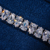 6MM Pear Cut Tennis Bracelet in white gold with sparkling CZ stones on blue background