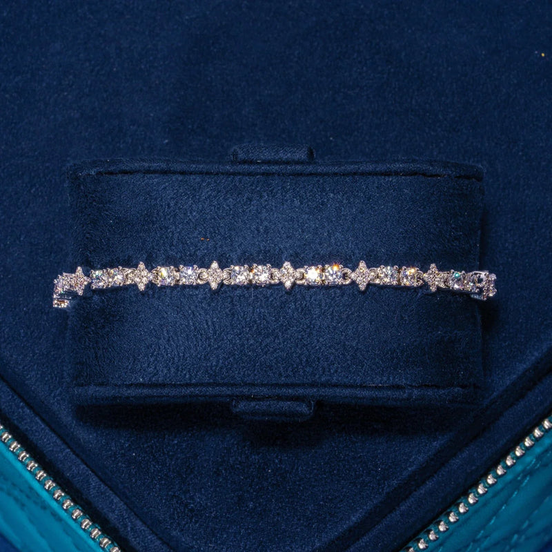 3MM Moissanite Round and Star iced tennis bracelet in 925 silver with D color VVS1 stones on navy blue velvet display