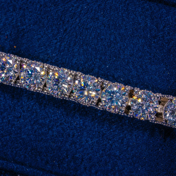 5MM Full Iced Tennis Bracelet in white gold with sparkling CZ stones on blue background