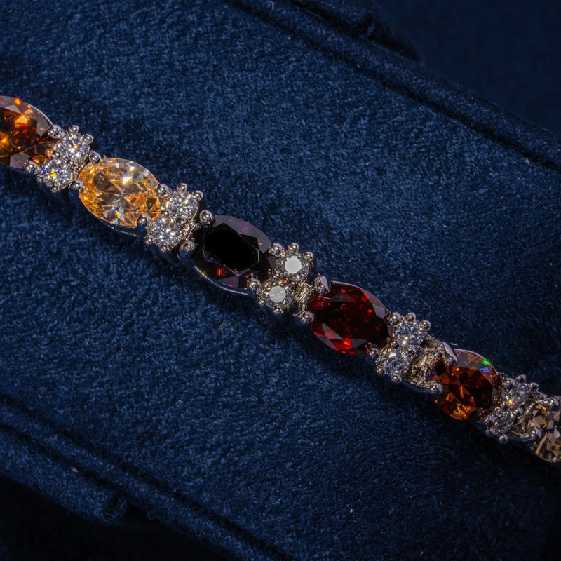 5MM multicolor oval cut brown stone tennis bracelet in white gold on navy blue background