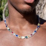 10MM multi gemstone chain in white gold, worn close-up, featuring colorful prong-lifted stones.