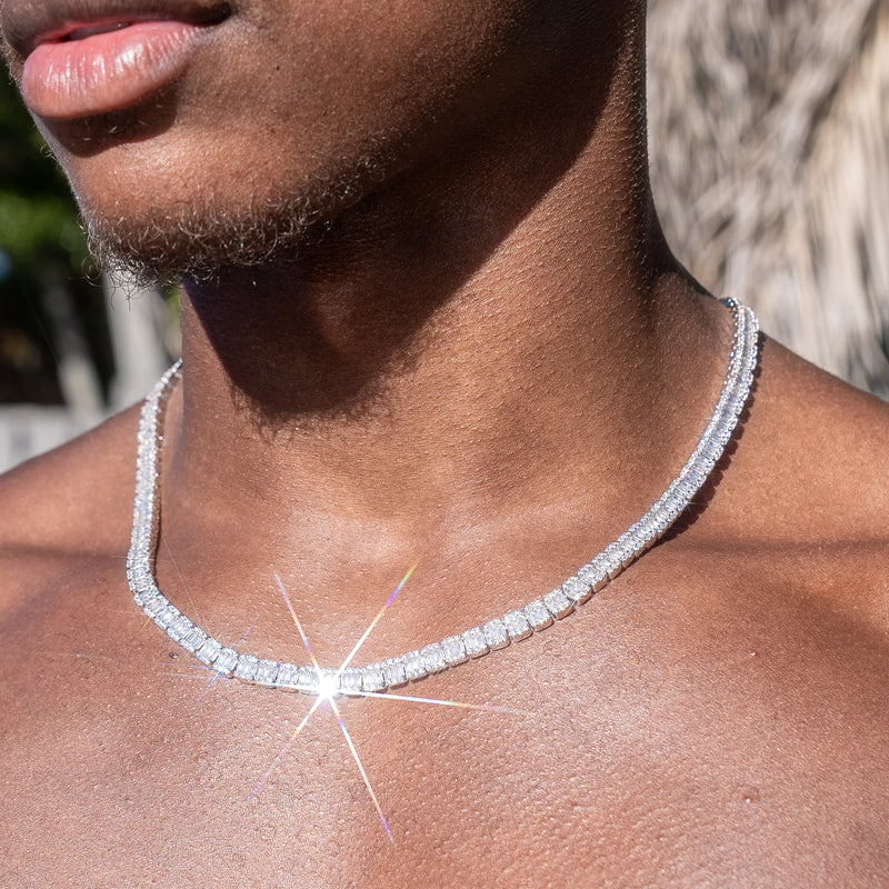 6MM Baguette Tennis Chain in white gold worn by a model, featuring prong-lifted stones and flawless diamond simulants.