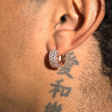 Moissanite 3-row hoop earrings in rose gold with sparkling stones worn on ear