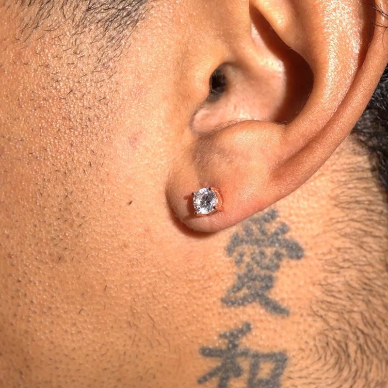 Close-up of ear wearing rose gold moissanite stud earring with 925 silver setting and D colour VVS1 stone