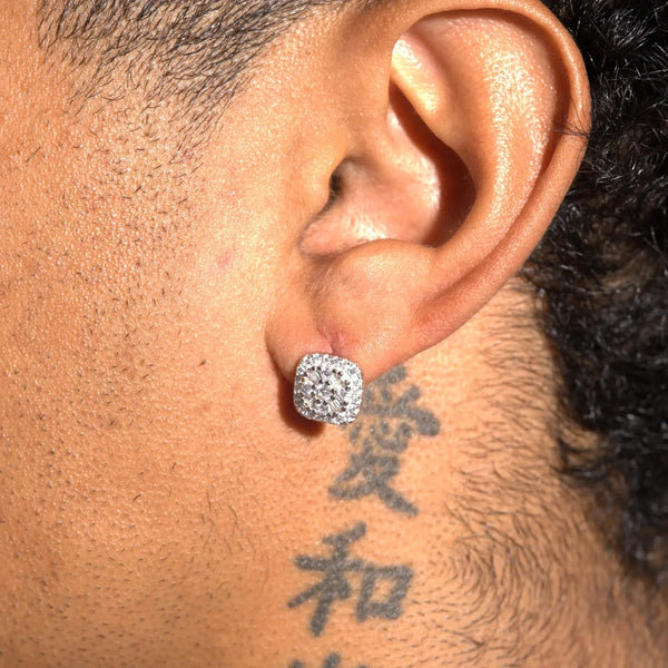 Moissanite 10MM baguette square stud earrings in 925 silver worn on ear with tattoo background