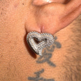 Close-up of Moissanite S925 Heart Earring with white gold plating worn on ear