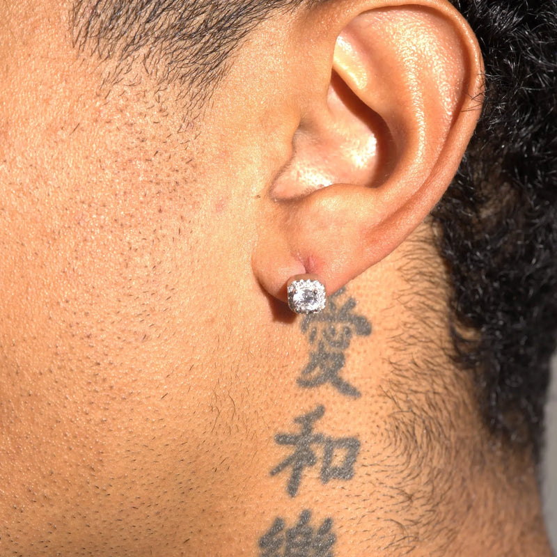 Moissanite 7mm cluster stud earring in 925 silver worn on ear with tattoo background