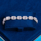 8mm centre baguette bracelet in white gold with hand-set stones on blue velvet display
