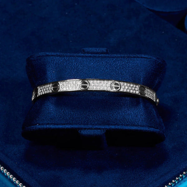 White gold Iced Band Bracelet with flawless VS diamond simulants on navy blue cushion
