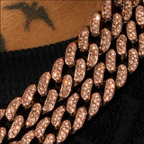 Close-up of 8mm moissanite iced Cuban link chain in rose gold with sparkling stones and polished finish