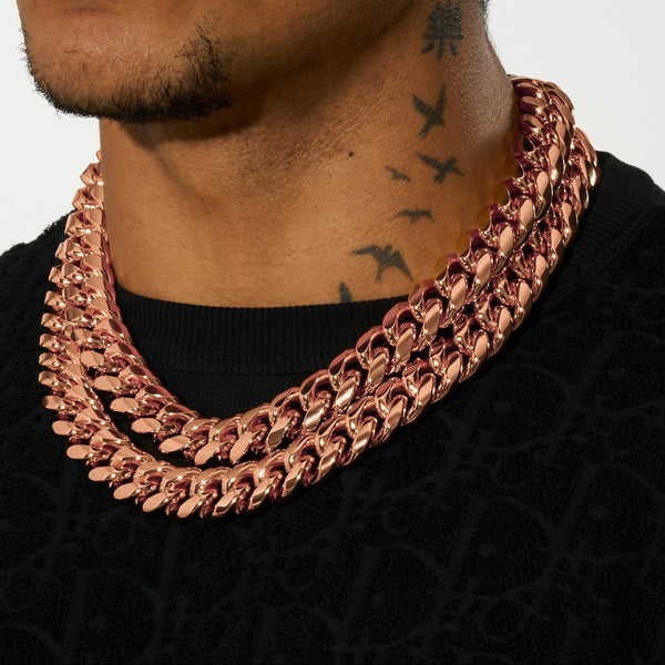 Moissanite 20mm rose gold Cuban iced clasp chain on neck in black shirt