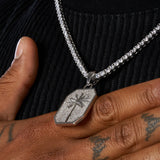 Palm tree pendant necklace in white gold with diamond simulant detailing on a men's hand
