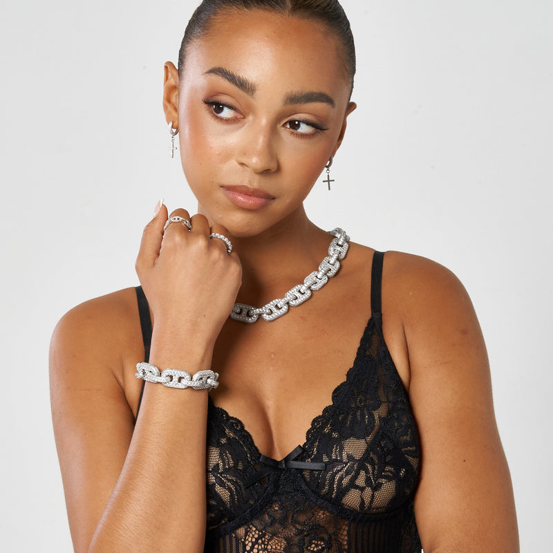 17mm G-Link diamond bracelet in white gold worn by woman with black lace top