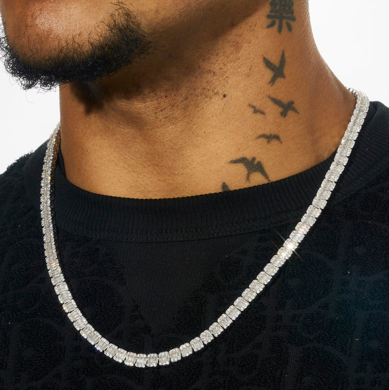 6MM Baguette Tennis Chain in white gold with prong-lifted stones, on a model's neck.