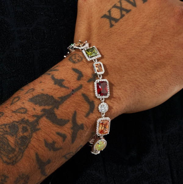 10MM multi gemstone bracelet in white gold on tattooed wrist.