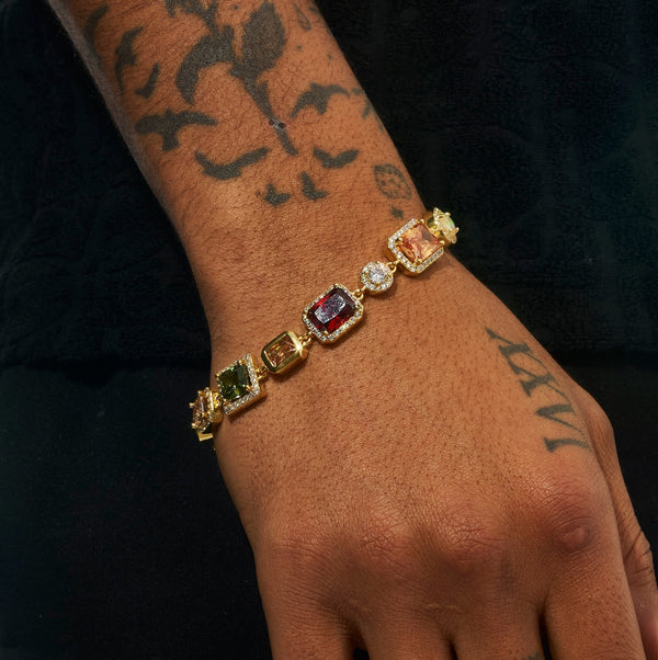 10MM Multi Gemstone Bracelet in gold with hand-set stones worn on tattooed wrist.