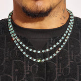 5MM Blue & Black Tennis Chain in white gold with diamond simulants worn on neck