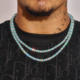 5MM Blue & White Tennis Chain in white gold worn on neck with sparkling diamond simulants