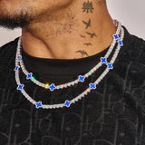 5MM Moissanite Blue Motif Tennis Chain in 925 Silver with blue floral accents and white gold plating worn on neck