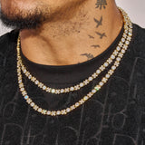 close-up of gold 5MM XOXO Chain with diamond simulants worn on neck