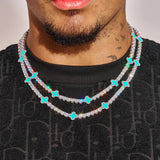 5MM Moissanite Green Motif Tennis Chain in 925 Silver with white gold plating worn on neck