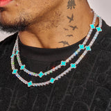 5MM Moissanite Green Motif Tennis Chain in 925 Silver with D Colour VVS1 stones on male model wearing black shirt