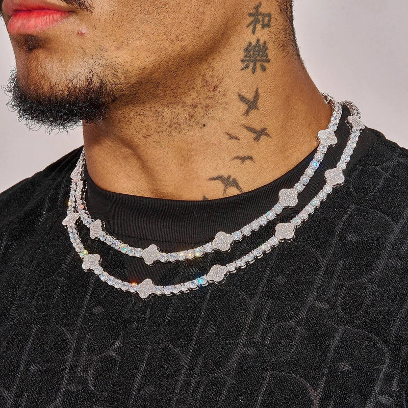 5MM Moissanite Iced Motif tennis chain in 925 silver with white gold plating, worn layered on neck