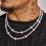 5MM moissanite pink motif tennis chain in 925 silver with white gold plating and VVS1 D colour stones worn on neck