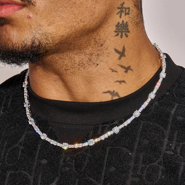 Gem Stationed Tennis Chain in white gold with spaced gemstones worn around neck