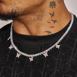 Iced Butterfly Tennis Chain in white gold with sparkling diamond simulants and butterfly accents worn on neck