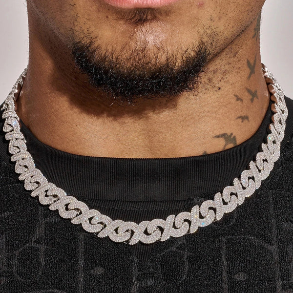 12MM Moissanite iced out baguette infinity link chain in white gold plating on 925 sterling silver worn on neck