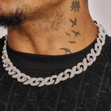 14MM iced out figure 8 link chain in white gold with radiant stones worn on neck