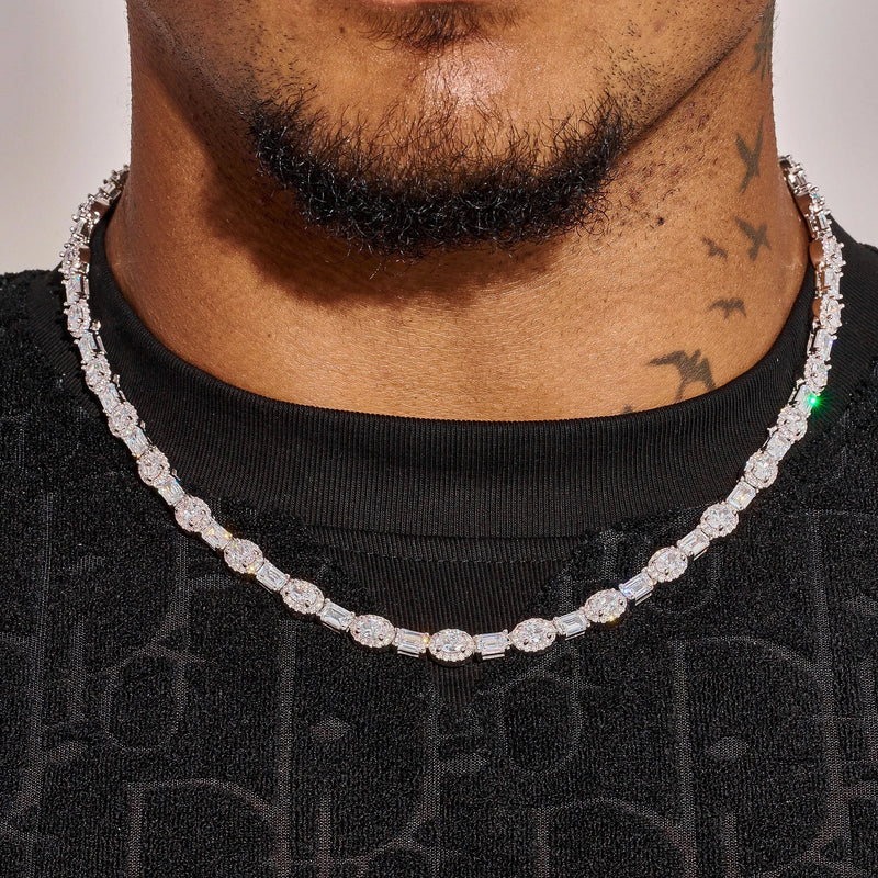 7MM Oval Emerald Cut Tennis Chain in white gold on neck with oval emerald cut stones and diamond simulants