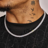 6MM Pear Cut Tennis Chain in white gold with sparkling stones worn on man's neck