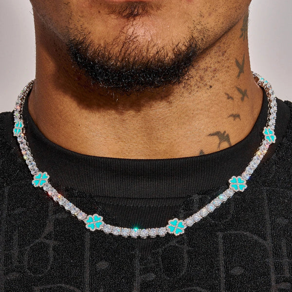 Close-up of 5MM Moissanite Blue Clover Tennis Chain with turquoise clover-shaped stones on a male neck
