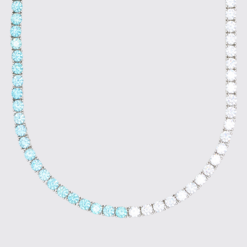 5mm pale blue and white tennis chain in white gold with round prong-lifted stones.