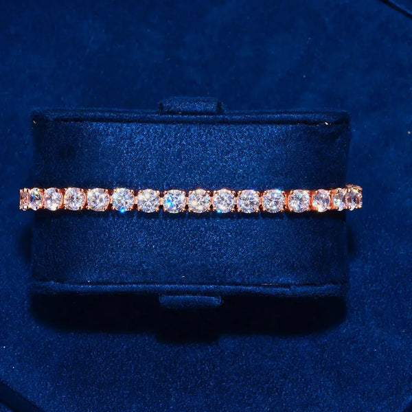 5mm Moissanite tennis bracelet in rose gold with round cut stones on blue velvet display