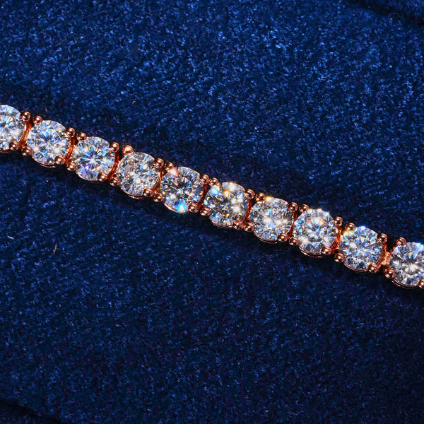 3mm Moissanite tennis bracelet in rose gold with round cut stones on navy background