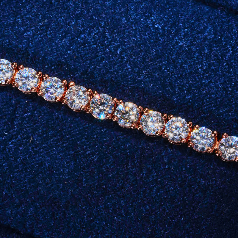 3mm Moissanite tennis bracelet in rose gold with round cut stones on navy background