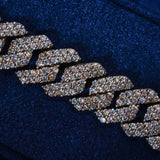 10MM Monaco Bracelet close-up showing white gold links with hand-set prong-lifted sparkling CZ stones on dark blue background