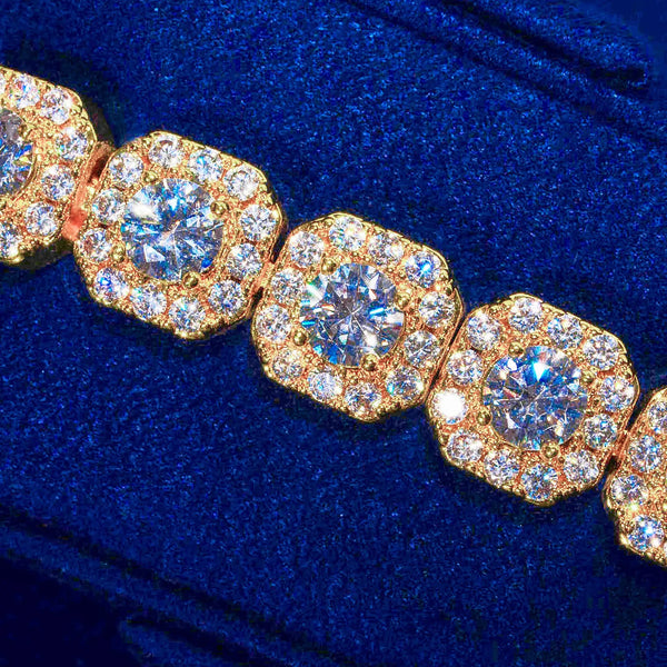 10mm clustered tennis bracelet gold with hand-set CZ stones and layered design on blue background