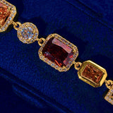 10MM Multi Gemstone Bracelet - Gold with large center stones and CZ accents on blue background